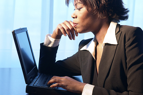 woman working in front of a laptop 